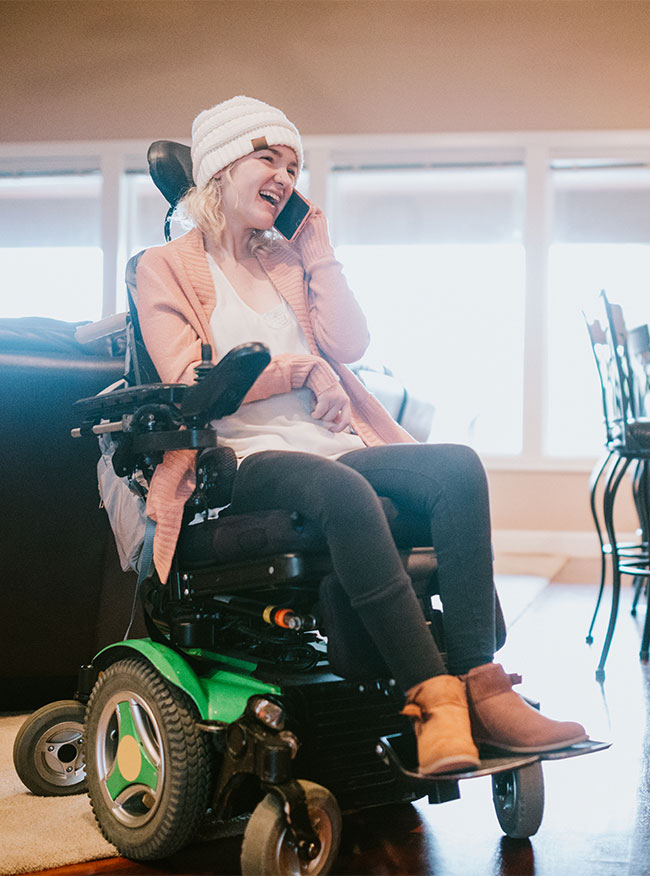 person in home in a wheelchair